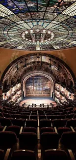 Theater with an ornate dome and detailed interior, perfect wallpaper for architecture fans.