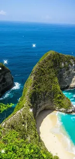 Tropical beach with azure waters and green cliffs under a clear blue sky.