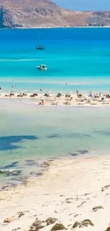 Tropical beach with turquoise water and distant island.