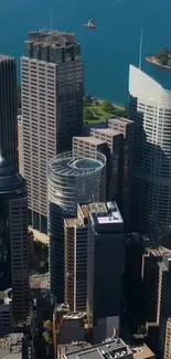 Aerial view of city skyscrapers with waterfront.