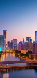 Vibrant city skyline at twilight with neon lights reflecting on water.