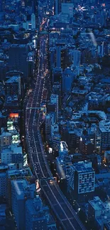 Aerial view of a vibrant city at night, illuminated by striking neon lights.