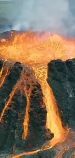 Orange lava flows from a volcanic eruption, creating a striking visual display.