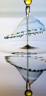 Artistic water drop reflecting on ripple surface.