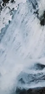 Aerial view of a stunning waterfall with icy textures.