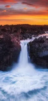 Majestic waterfall under a vibrant sunset sky, showcasing nature's beauty.