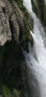 Waterfall cascading down a rocky cliff.