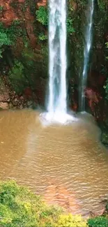 Lush green waterfall cascading into a serene pond.