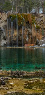 Beautiful waterfall wallpaper with lush greenery and tranquil waters.