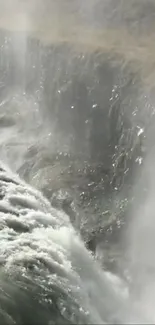 Close-up view of a stunning waterfall with cascading water and mist.