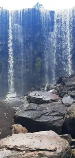 Waterfall cascading over rocky terrain with serene natural beauty.