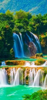 Vibrant turquoise waterfall with lush greenery mobile wallpaper.