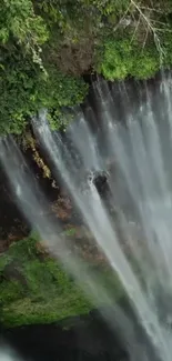 A captivating waterfall with lush greenery, perfect for a nature-themed wallpaper.