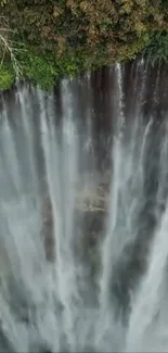 A stunning waterfall with lush greenery cascading gracefully.