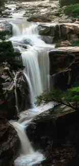 Cascading waterfall with lush green scenery, perfect mobile wallpaper.