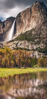 Majestic waterfall on a mountain with forest reflection.