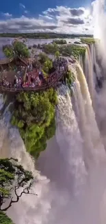 A stunning view of a large waterfall surrounded by lush greenery under a clear blue sky.