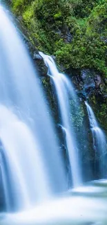 Cascading waterfall with lush greenery, perfect for mobile wallpaper.