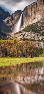 Majestic waterfall and mountain reflected in a tranquil lake.