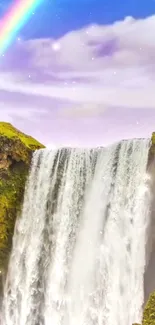 Majestic waterfall with vibrant rainbow and lush greenery.