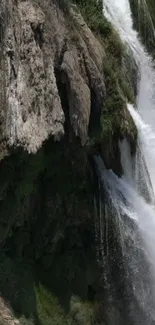 Vibrant scene featuring a waterfall over rocks.