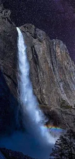 Waterfall cascading at night under a starry sky with galaxy hues.