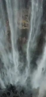 Beautiful vertical waterfall portraying serene cascading water down the rocks.