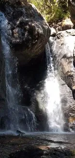 Cascading waterfall over rocky cliffs in nature wallpaper.