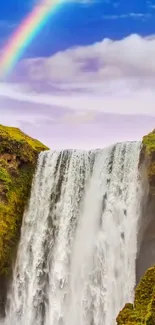 Majestic waterfall with rainbow creating a stunning natural scene.