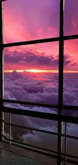 A stunning sunset view through a window with purple and pink clouds.