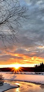 Winter sunrise over frozen river with snowy landscape.