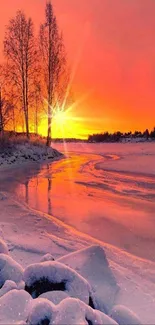 Beautiful sunset scene over a frozen river in winter with snow and warm colors.