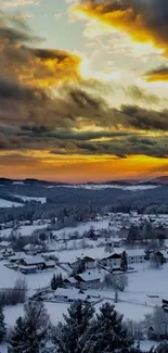 Winter village at sunset with vibrant sky.