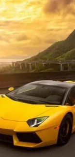 Yellow sports car driving through scenic landscape with cloudy sky.