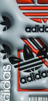 Adidas logo embossed monochrome wallpaper with red accents.