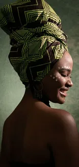 African woman with traditional headwrap in deep green tones.