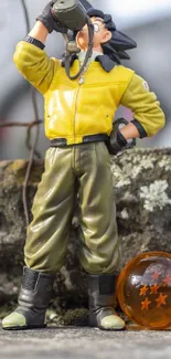 Anime figure in yellow jacket with dragon ball toy.