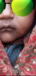 Cute baby in red shawl with sunglasses