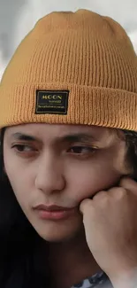 Trendy person wearing a yellow beanie.