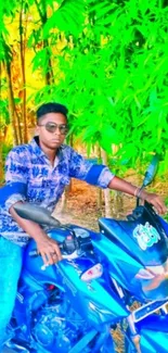 Man sitting on blue bike with vibrant green forest background.