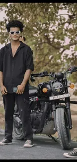 Friends posing with black motorcycle on a sunny day.