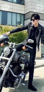 Biker in black leather jacket with motorcycle in urban setting.