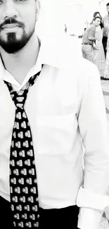 Black and white portrait of a stylish man in a unique tie.