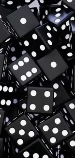 Pile of black dice wallpaper with white dots.