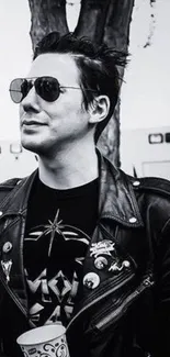 Man in a black and white style wearing a cool leather jacket.