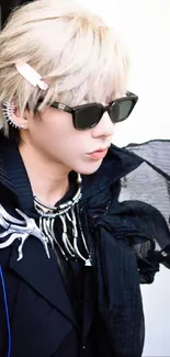 Person in black attire with sunglasses and unique accessory.