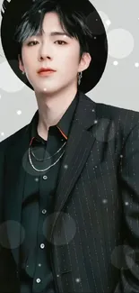 Person in a stylish black suit and hat, perfect for fashion enthusiasts.