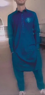 Man in stylish blue kurta and trousers.