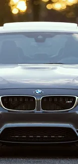 Front view of a sleek BMW car with a luxurious design for a mobile wallpaper.