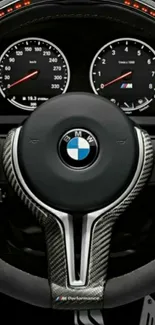 Close-up of BMW steering wheel in sleek design.